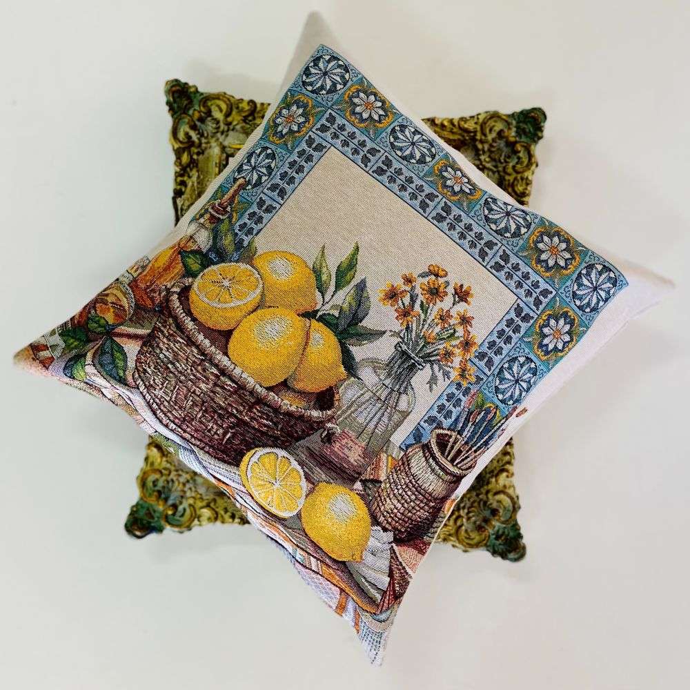 Decorative pillow with a lemon-themed design on a white background