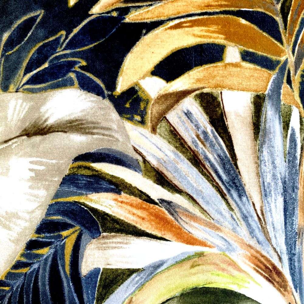 Close-up of a fabric with tropical leaf pattern in gold, blue, and green.