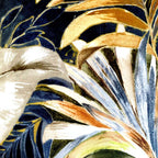 Close-up of a fabric with tropical leaf pattern in gold, blue, and green.