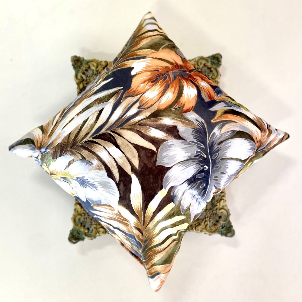 Decorative pillow with floral pattern on a white background