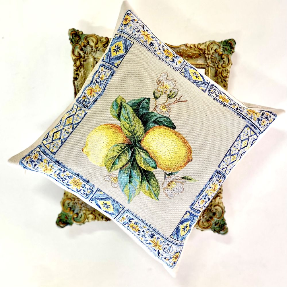 Decorative pillow with lemon design on a white background