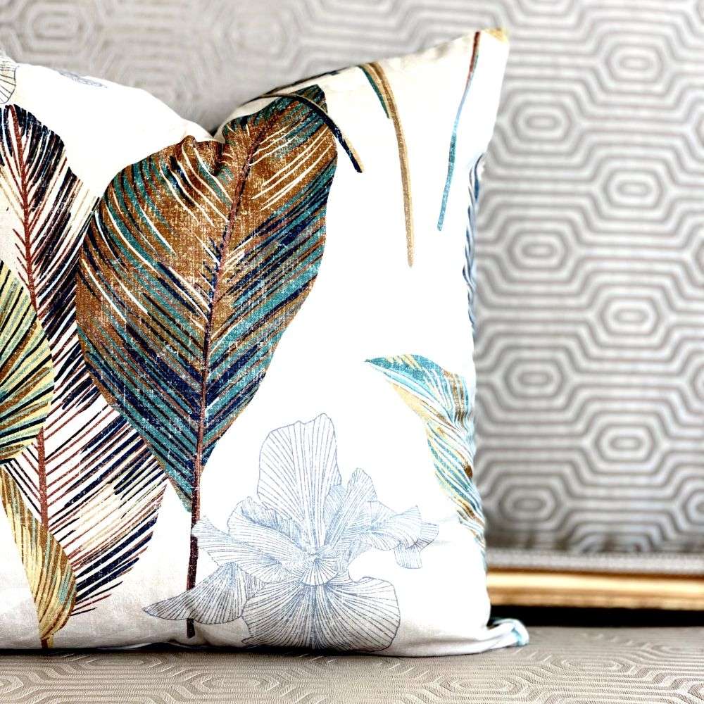 Decorative pillow with leaf patterns on a neutral background