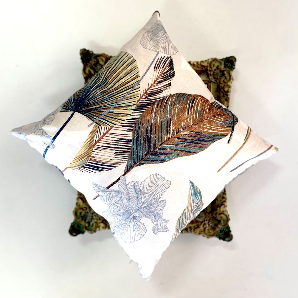 Decorative pillow with leaf pattern on a white background