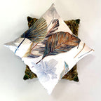 Decorative pillow with leaf pattern on a white background