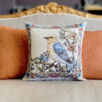 Decorative pillow with a bird design on a sofa
