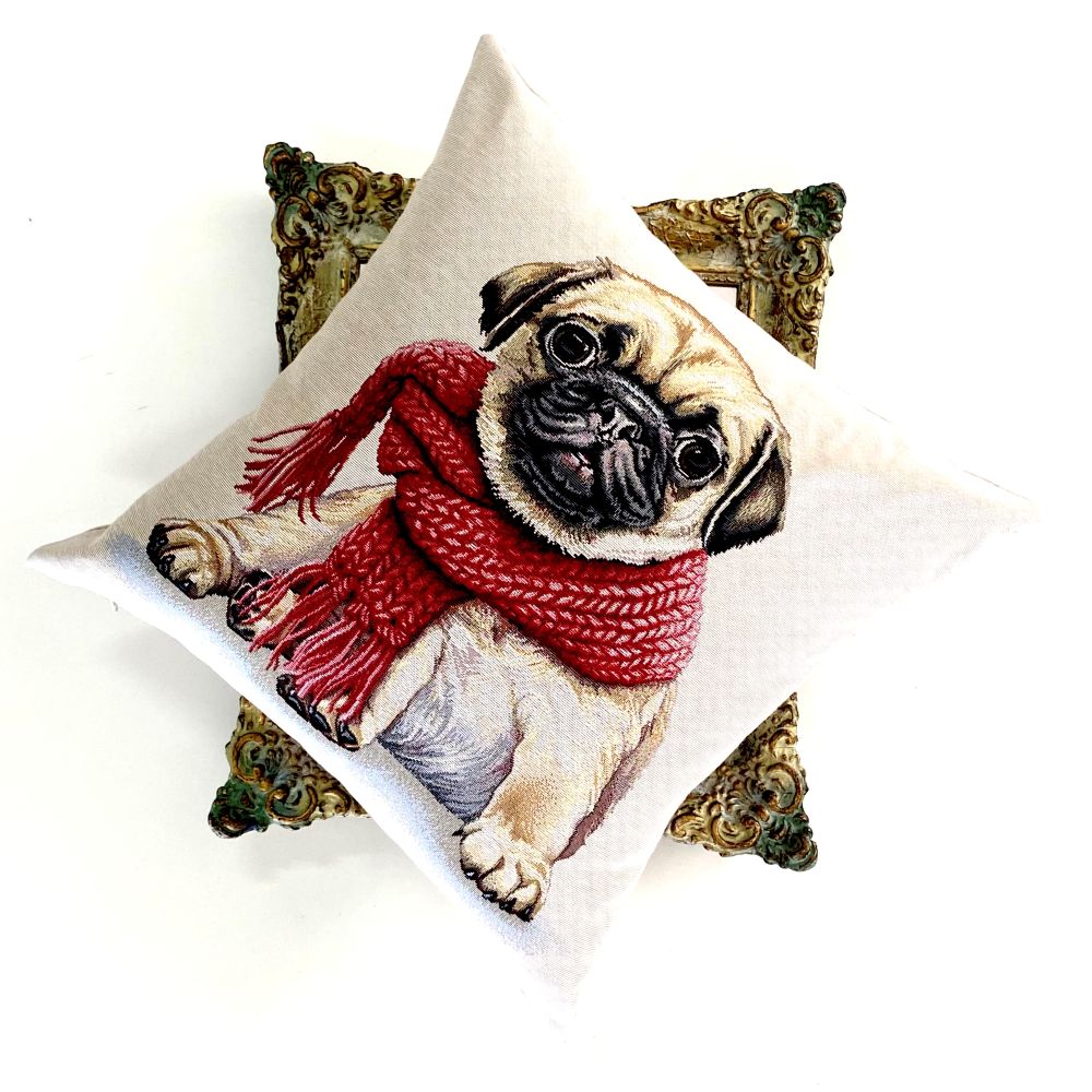 Pillow with a pug dog wearing a red scarf on a white background