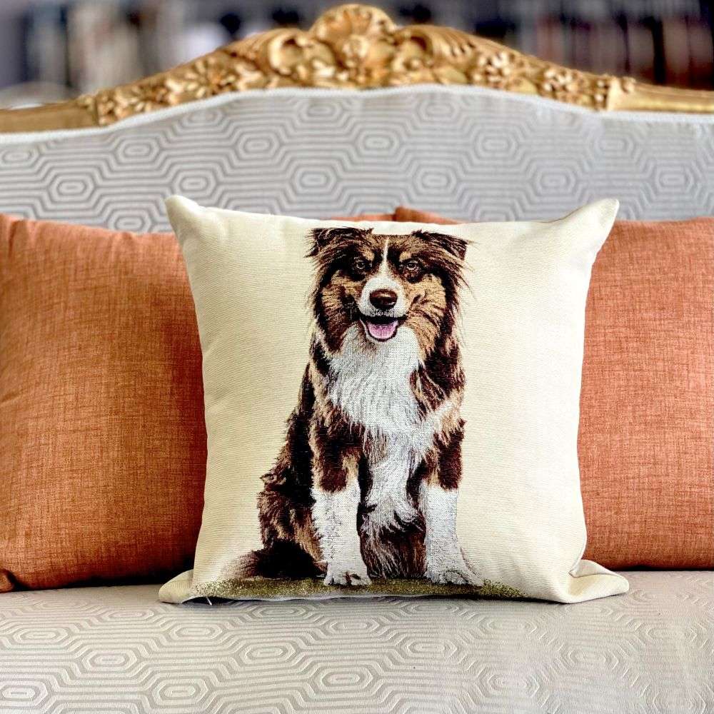 Decorative pillow with a dog print on a sofa