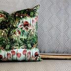 Decorative pillow with tropical floral pattern on a textured wall background