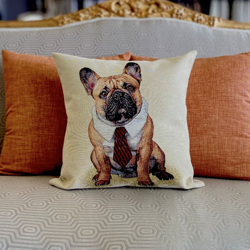Decorative pillow with a dog design on a couch with orange cushions