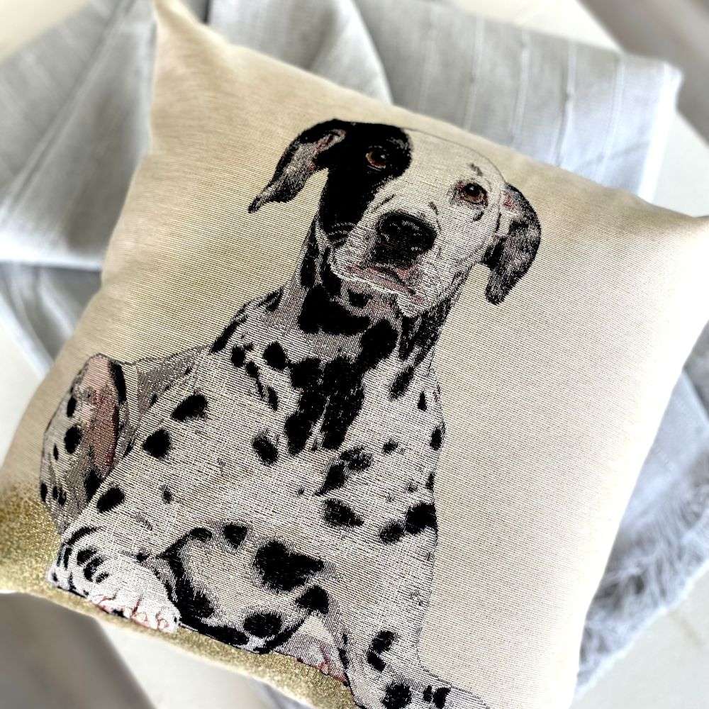 Pillow with a Dalmatian dog illustration on a neutral background