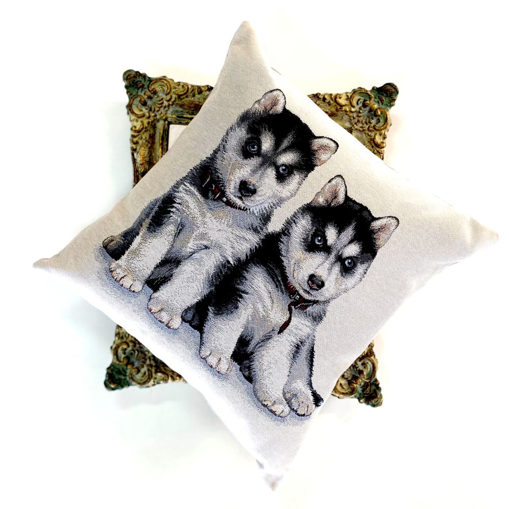 Decorative pillow with two husky puppies on a white background