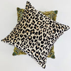Leopard print pillow on a decorative pillow with a white background