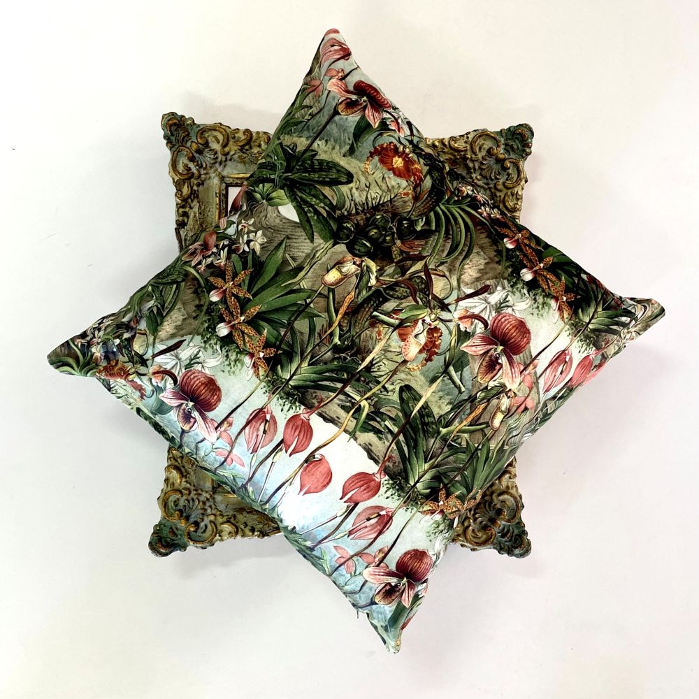 Decorative pillow with floral pattern on a white background