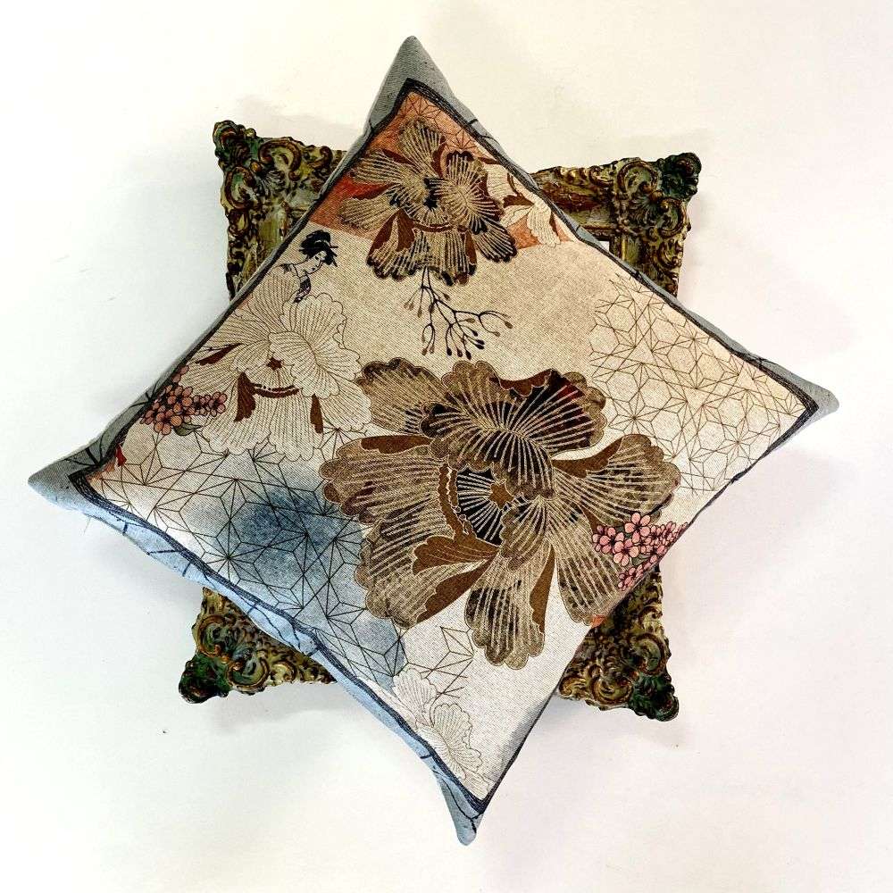 Decorative pillow with floral pattern on a white background