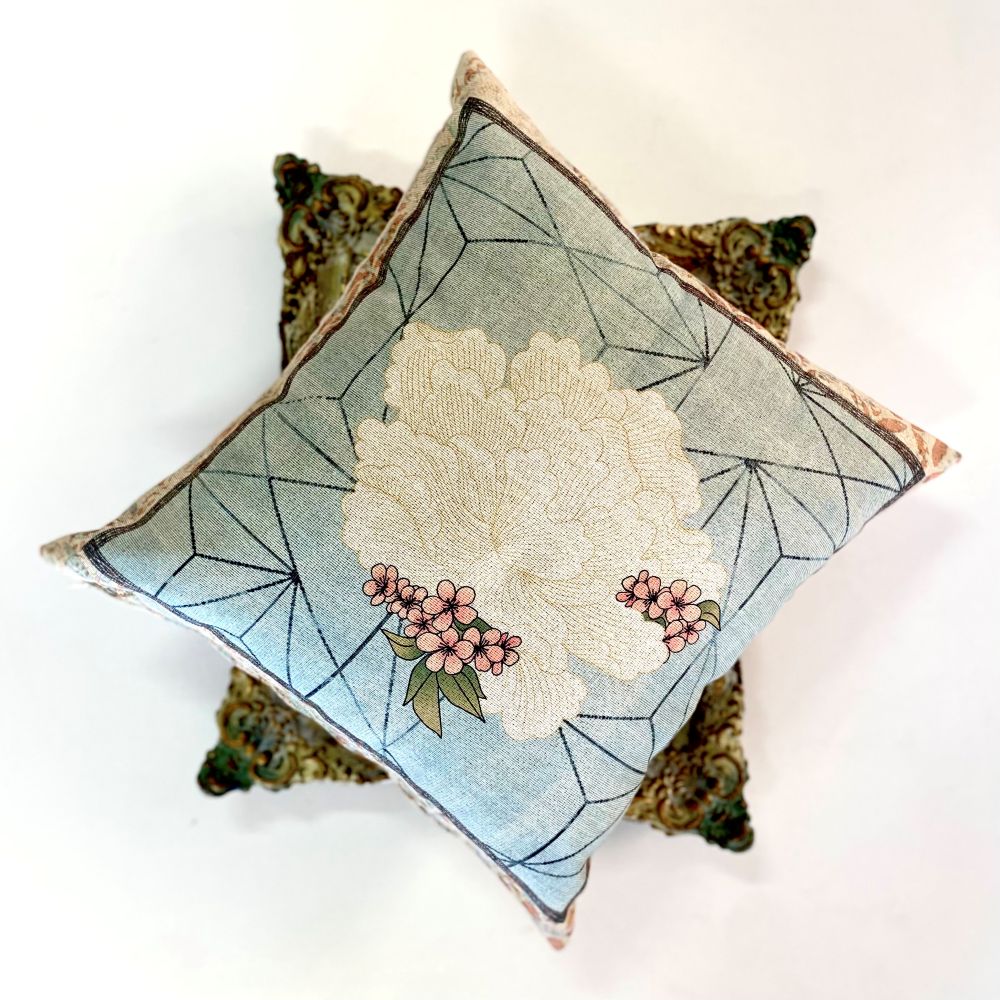 Decorative pillow with floral design on a white background