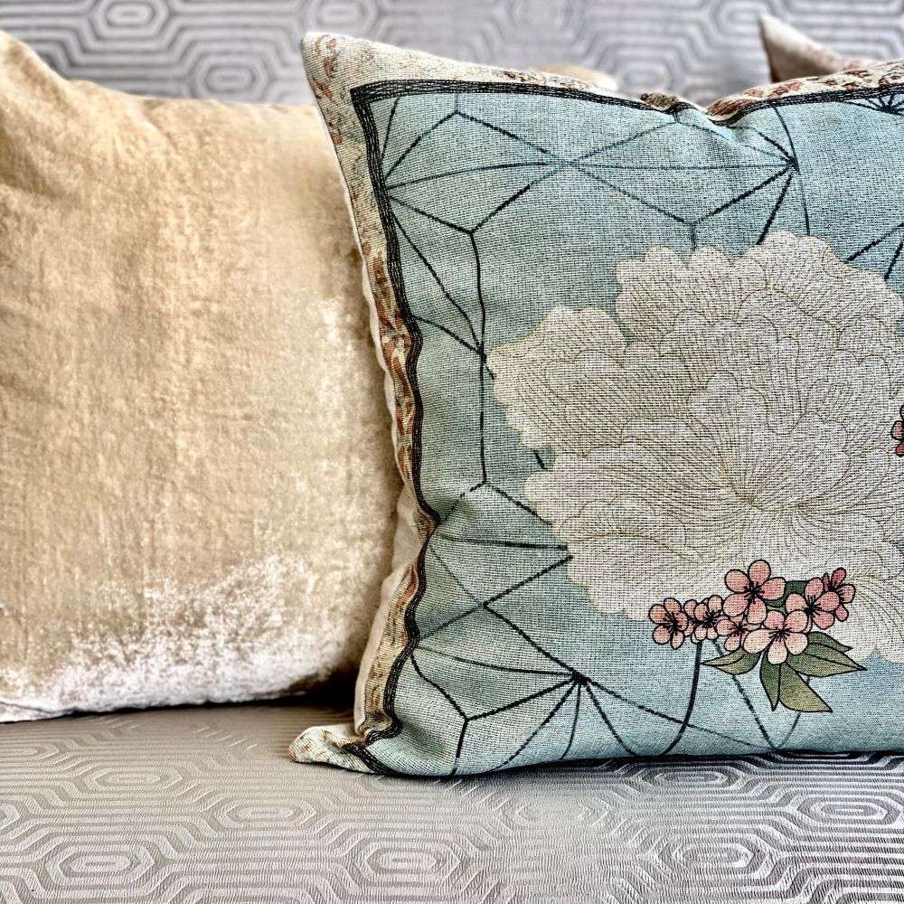 Decorative pillow with floral design on a sofa