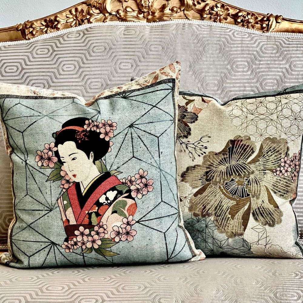 Decorative pillows with Japanese-themed designs on a patterned surface