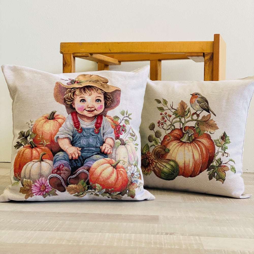Decorative pillows with autumn-themed designs on a couch.