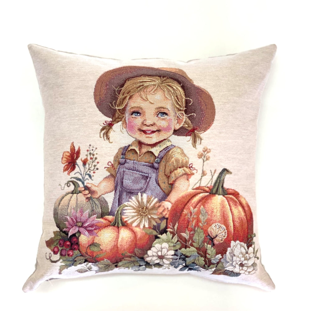 Decorative pillow with a child holding pumpkins and flowers on a beige background